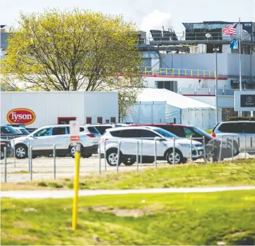  ?? Joseph Cres / Iowa City Pres- Citizen via the asociate
d pres ?? Tuesday was the first day of a temporary shutdown at a Tyson Foods pork processing
plant in Columbus Junction, Iowa., due to an outbreak of COVID-19.