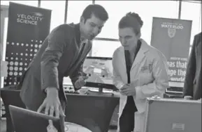  ?? IAN STEWART, SPECIAL TO THE RECORD ?? Federal Science Minister Kirsty Duncan talks with University of Waterloo alumnus Morteza Ahmadi about his work in health technology at the University on Monday.