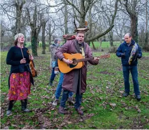  ??  ?? The Shady Wilcox Experience play as villagers drink cider punch