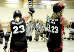  ??  ?? Lil Chicago sporting their new team jerseys as the wait for a bout to start.