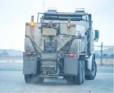  ??  ?? City crews in sanding trucks, like this one on Park Street, also had to be cautious on the roads on Wednesday morning.