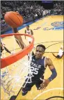  ?? Joe Murphy / Getty Images ?? Yale’s Miye Oni dunks the ball against Memphis on Nov. 17 at FedEx Forum in Memphis, Tenn.