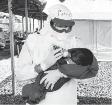  ??  ?? B.C. nurse Patrice Gordon has tested negative for a third time for Ebola. She had earlier shown signs that she may have carried home the virus after working with the Red Cross in Sierra Leone (left). Gordon is also shown with her dog Rico, a Pyrenean...