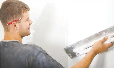  ?? PHOTOS: GETTY IMAGES ?? Skim-coating a wall with a thin layer of drywall compound is one way to create a smooth surface to make a good paint job look even better. Depending on your budget, you might consider hiring a profession­al to do the job properly.