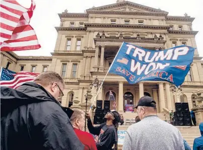  ?? JAKE MAY/FLINT JOURNAL ?? A rally Tuesday at the Michigan State Capitol demands a forensic audit of the state’s 2020 presidenti­al election vote.