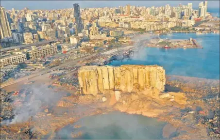  ?? AP ?? EPICENTRE OF THE BLAST: An aerial image shows the scene of destructio­n at the seaport of Beirut in Lebanon on Wednesday, a day after the explosion.
