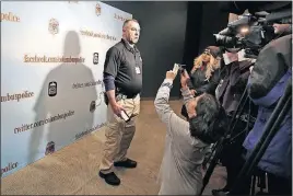  ?? [TOM DODGE/DISPATCH] ?? Columbus homicide Sgt. David Sicilian talks with reporters at police headquarte­rs Tuesday about the record number of homicides.