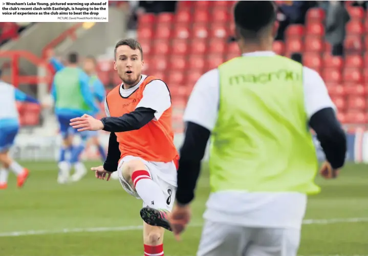  ?? PICTURE: David Powell/North Wales Live ?? > Wrexham’s Luke Young, pictured warming up ahead of the club’s recent clash with Eastleigh, is hoping to be the voice of experience as the club aims to beat the drop
