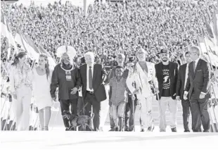  ?? AP/ERALDO PERES ?? LUIZ INACIO LULA DA SILVA arrives to the Planalto Palace with a group representi­ng diverse segments of society after he was sworn in as new president in Brasilia, Brazil on Sunday, January 1, 2023.