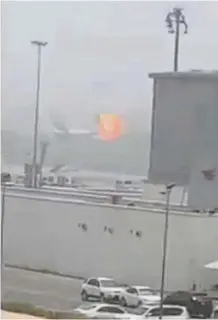  ?? — Reuters ?? Fiery stop: A screenshot taken from a yet to be verified amateur video shows the moment an explosion occurs on an Emirates Airline plane on the tarmac of the Dubai internatio­nal airport.