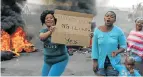  ?? Picture: FREDLIN ADRIAAN ?? ANGRY RESIDENTS: People protest after being left on the street