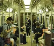  ?? KARSTEN MORAN/THE NEW YORK TIMES ?? Passengers ride the subway June 16 in New York. The nation’s share of commuters who rely on public transporta­tion fell by half in just two years.