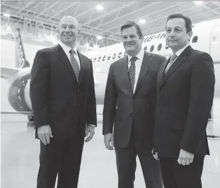  ??  RYAN REMIORZ/THE CANADIAN PRESS ?? Bombardier CEO Alain Bellemare, left, former CEO and executive chairman Pierre Beaudoin and president of Bombardier Commercial Aircraft Mike Arcamone stand in front of a CS300 before its first test flight in Mirabel, Que., on Friday.