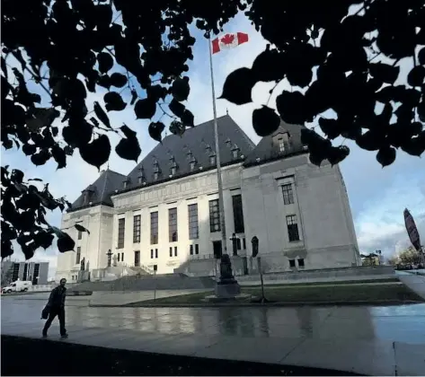  ?? THE CANADIAN PRESS FILES ?? A pedestrian walks past the Supreme Court of Canada in this file photo.