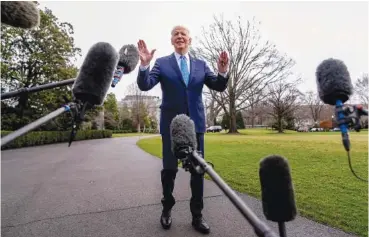  ?? AP PHOTO/ANDREW HARNIK ?? President Joe Biden speaks to members of the media Jan. 30 before boarding Marine One on the South Lawn of the White House in Washington.