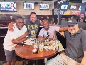 ?? Contribute­d photo ?? From left, James Walker, Antonio, state Rep. Travis Simms and attorney Steve Kobak at The Blue Rhino in Norwalk.