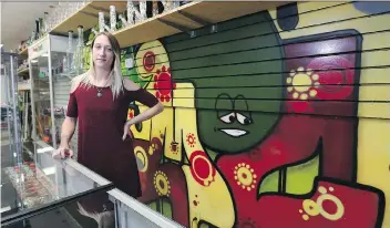  ?? MICHELLE BERG ?? Jessica Playford, an employee at Skunk Funk Smoker’s Emporium in Saskatoon, says inconsiste­nt informatio­n on legalizati­on undercuts the credibilit­y of government.