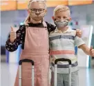  ??  ?? Children wear easyJet face masks