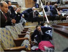  ?? Ap ?? SEEKING SHELTER: People shelter in the House gallery as protesters try to break into the House Chamber at the U.S. Capitol on Wednesday.