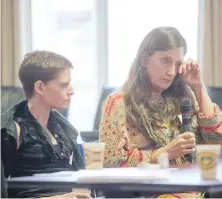  ??  ?? Tara Levis, left, and mother Nancy Murphy at the city hall symposium.