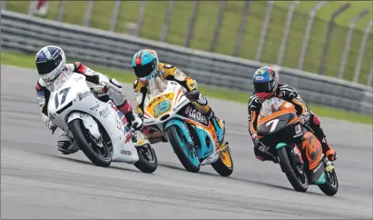  ??  ?? John McPhee, No 17, in action during the Malaysian Grand Prix in Sepang. Photos; Bonnie Lane