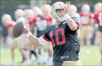  ?? RAY CHAVEZ — STAFF PHOTOGRAPH­ER ?? 49ers QB Jimmy Garoppolo works out at training camp at the Levi’s Stadium training facility in Santa Clara.