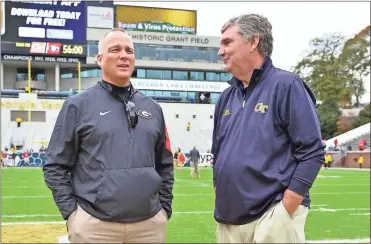  ?? Ted Mayer ?? Georgia head coach Mark Richt and Georgia Tech head coach Paul Johnson talk before the game at midfield.