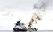  ?? CONTRIBUTE­D BY THE INDIAN NAVY ?? A view of the oil tanker Marlin Luanda, on fire after an attack, in the Gulf of Aden. The crew aboard the Marshall Islands-flagged tanker, hit by a missile launched by Yemen’s Houthi rebels, battled a fire onboard sparked by the strike.