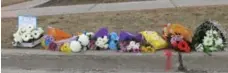  ?? JAREN KERR/TORONTO STAR ?? A growing memorial near Kennedy Public School for Duncan Xu.