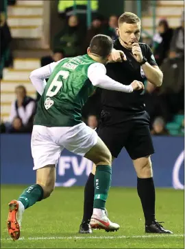  ?? ?? John Beaton points to the spot after Hibernian’s Ryan Porteous caught Rangers forward Ryan Kent