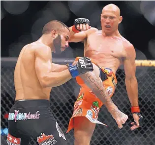  ?? ASSOCIATED PRESS FILE ?? Donald Cerrone, right, has gone from a fan favorite to a respected veteran in the UFC.