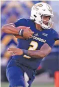  ?? STAFF PHOTO BY ROBIN RUDD ?? UTC quarterbac­k Drayton Arnold runs the ball against Western Carolina this past Sept. 28 at Finley Stadium. Of the three scholarshi­p quarterbac­ks on the Mocs’ roster entering the 2020 season, Arnold is the only one who played in college last year.