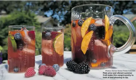  ?? Photos: Darren Stone/times Colonist ?? Pink wine and vibrant summer fruit make this sangria pretty to look at and pleasing to sip.