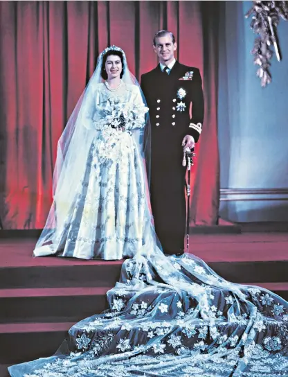  ??  ?? Love match: Queen Elizabeth (then Princess Elizabeth) and the Duke of Edinburgh at Buckingham Palace on their wedding day in 1947. Far left, the couple on their silver wedding anniversar­y in 1972