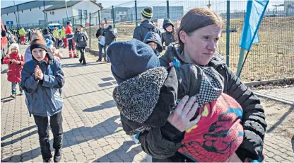  ?? ?? Ukrainian refugees arriving in southeaste­rn Poland on Friday: one reason Poles are clamouring to assist is because they understand the idea of national independen­ce in the face of oppression