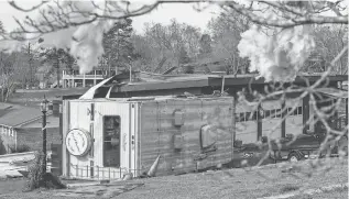  ??  ?? Storms caused damage Tuesday evening, leaving a toppled RV next to a damaged garage the next day in Hixson, Tenn. More storms are forecast across the southern USA over the next few days.
DOUG STRICKLAND, AP