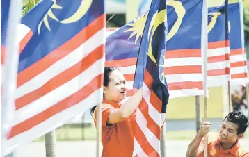  ??  ?? Malaysia is expected to grow at 5.5 per cent for 2018, pending the outcome of US-China trade talks and rising uncertaint­ies on the back of the upcoming GE14. — Bernama photo