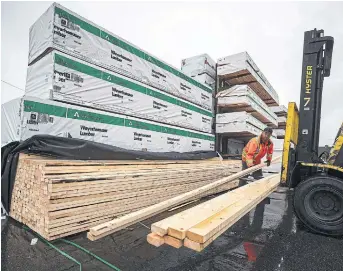  ?? DARRYL DYCK THE CANADIAN PRESS FILE PHOTO ?? The gains in the wholesale trade came as the building material and supplies sector rose 3.8 per cent to $14.1 billion in March.