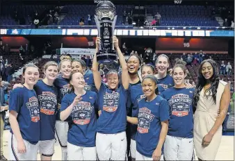  ?? [JESSICA HILL/THE ASSOCIATED PRESS] ?? The Connecticu­t women’s basketball team poses with the championsh­ip trophy after defeating South Florida in the American Athletic Conference title game. IONA 87, SIENA 86, OT: No. 4 GONZAGA 77, SANTA CLARA 68: