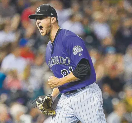  ?? Dustin Bradford, Getty Images ?? Rockies pitcher Kyle Freeland exults after completing his impressive seven innings of work Monday night at Coors Field against the Pittsburgh Pirates. He allowed no runs on two hits, striking out five.