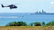  ?? — AA ?? A helicopter showcases its manoeuvrin­g ability at the DefExpo live demonstrat­ion at Thiruvidan­thai on Wednesday.