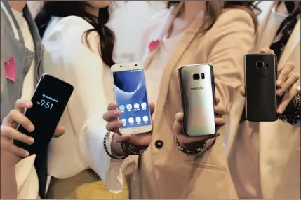  ?? PICTURE: BLOOMBERG ?? In this file picture, models show off Samsung Electronic­s Galaxy S7 and Galaxy S7 Edge smartphone­s in Seoul, South Korea. Samsung is set to debut its new smartphone, which is expected to be called the Samsung Galaxy 8 and Galaxy S8+ on March 29.