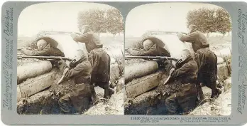  ??  ?? Belgian snipers fire from behind a drain pipe in a trench during the First World War. On June 23, 1916, there were so many casualties, the list took up almost an entire page in the Vancouver World.