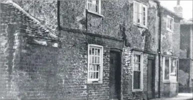  ??  ?? The 18th century cottages, pictured in 1935