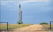  ??  ?? A rig is photograph­ed in 2018 drilling a well in the STACK play of the Anadarko Basin in Oklahoma. Crude oil prices and disappoint­ing results from infill wells have slowed activity in parts of the play, an analyst said. [OKLAHOMAN ARCHIVES]