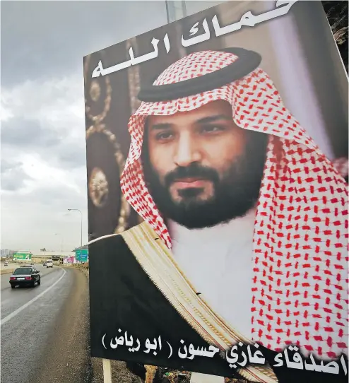  ?? IBRAHIM CHALHOUB / AFP / GETTY IMAGES FILES ?? A poster of Saudi Arabia’s Crown Prince Mohammad bin Salman, who has decided he needs to have a fight even as he presents himself as a reformer out to change traditiona­l Saudi ways, Father Raymond de Souza writes.