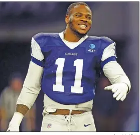  ?? Associated Press ?? All smiles: Dallas Cowboys linebacker Micah Parsons (11) smiles on the field during an NFL football practice Monday in Frisco, Texas.