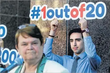  ?? Mark Boster Los Angeles Times ?? SUPPORTERS display signs while L.A. County Supervisor Sheila Kuehl and county health officials hold a news conference to discuss the Senate healthcare bill. “It would be devastatin­g to L.A. County,” she says.