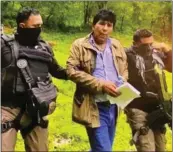  ?? MEXICO GOVERNMENT — FOR THE ASSOCIATED PRESS ?? In this handout photo, agents escort drug trafficker Rafael Caro Quintero in Sinaloa state, Mexico, on Friday after his capture,