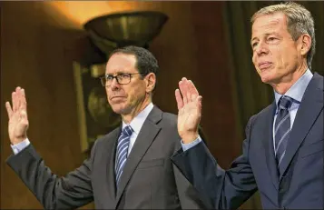  ?? KRISTOFFER TRIPPLAAR / SIPA USA 2016 ?? Randall Stephenson (left), chairman and CEO of AT&amp;T, and Jeffrey Bewkes, chairman and CEO of Time Warner, are sworn in before a U.S. Senate panel in December 2016. A federal judge is expected to issue his opinion today on the government’s effort to block AT&amp;T’s merger with Time Warner.